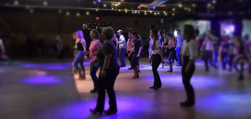 group-performing-a-coordinated-dance-at-a-texas-paint-horse-club-event