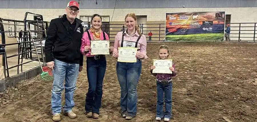 participants-posing-with-awards-at-a-cattlelac-elite-livestock-event