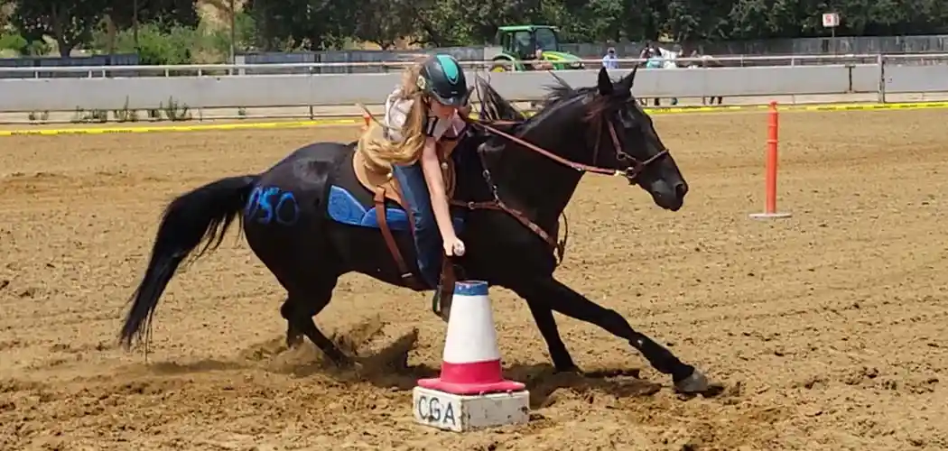 rider-competing-in-barrel-racing-at-a-california-gymkhana-association-event