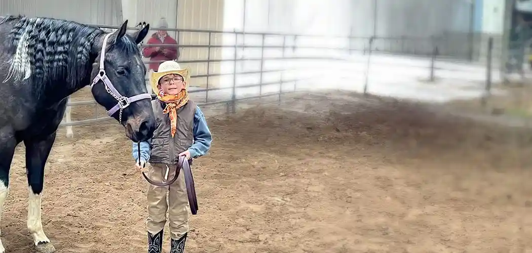 rider-working-with-a-horse-in-an-indoor-arena-at-latigo-trails-equestrian-center