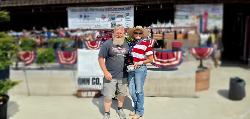 riders-standing-together-in-an-arena-at-a-tri-county-riders-event