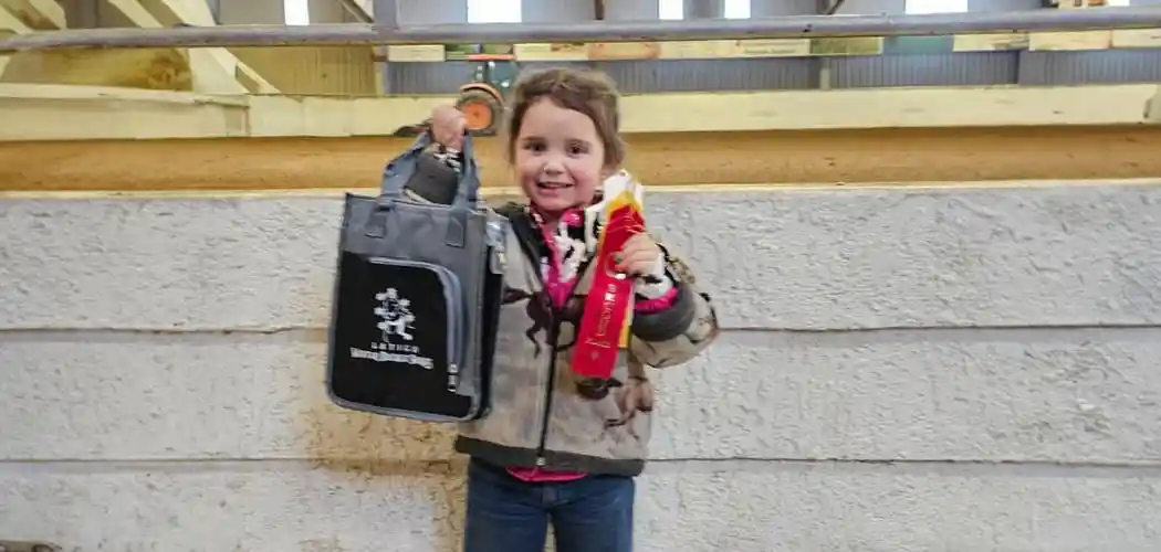 participant-holding-an-award-at-latigo-trails-equestrian-center