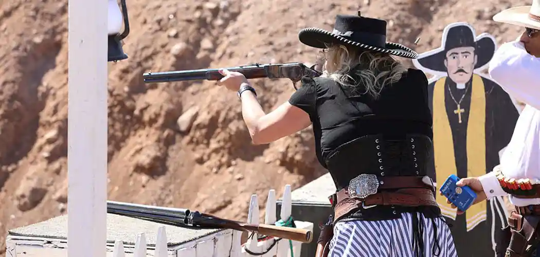 female-shooter-in-period-accurate-western-gear-operating-a-firearm-at-a-single-action-shooting-society-event