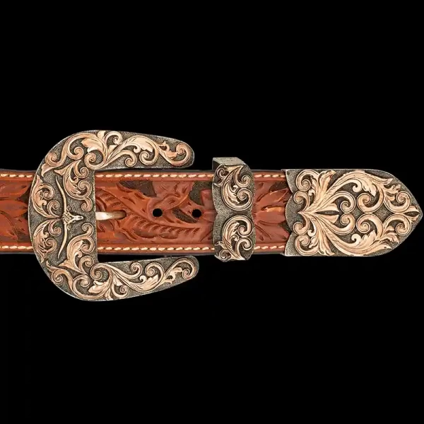 A custom western three piece belt buckle set featuring a longhorn figure 