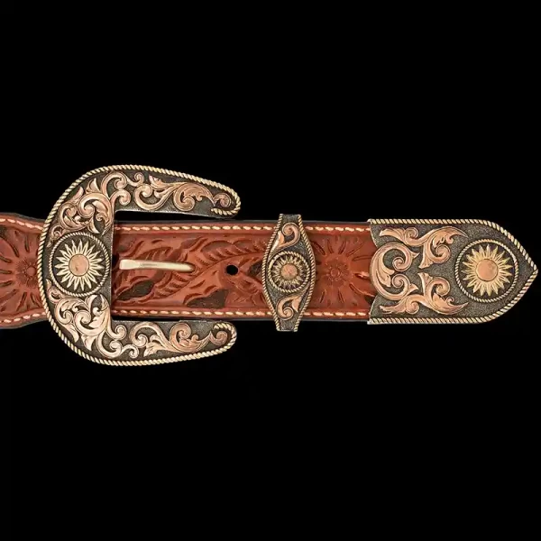 A custom western three piece belt buckle set featuring a bronze and copper scrollwork and sunflowers 
