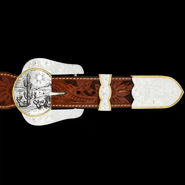 A custom western three piece belt buckle set featuring a silver plated base with a customizable western scene 