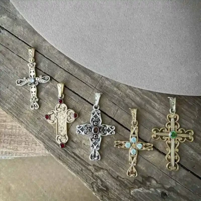 A collection of golden cross pendants