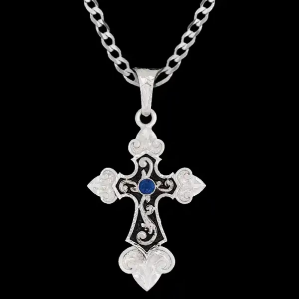 A custom silver cross pendant necklace for men and women, western-inspired design. featuring blue zirconia stones and black enamel