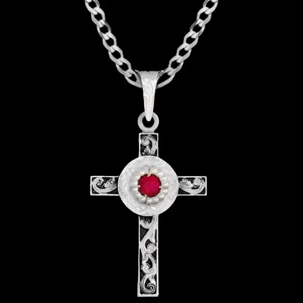 A custom silver celtic cross pendant necklace for men and women, western-inspired design. featuring a red zirconia stone