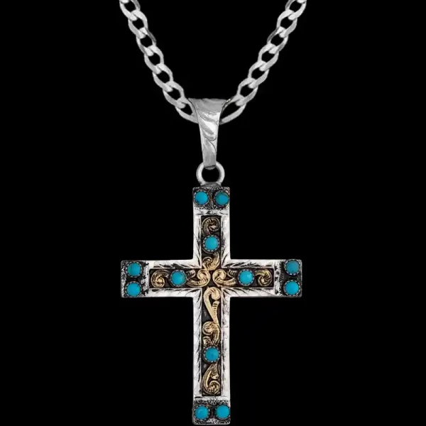 A custom silver cross pendant necklace for men and women, western-inspired design. featuring turquoise beads