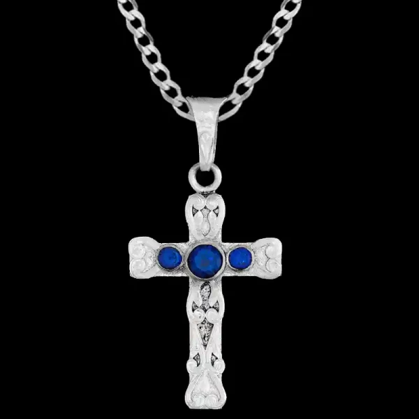 A custom silver cross pendant necklace for men and women, western-inspired design. featuring blue zirconia stones