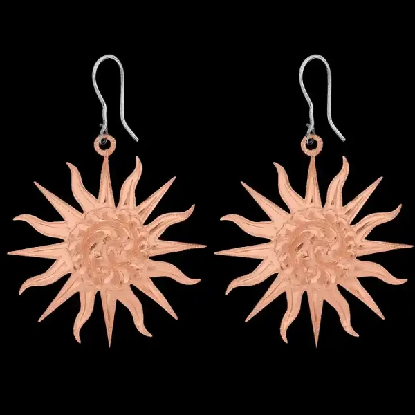A pair of copper western earrings for women, sun shaped and hand engraved
