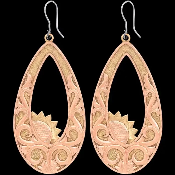 A pair of copper western earrings for women, teardrop shaped, featuring copper scrollwork and sun figures 