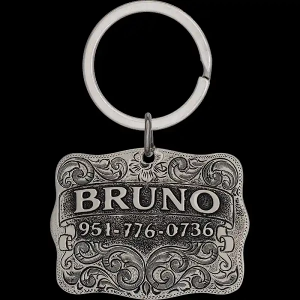 A custom dog tag with personalized engraved silver lettering built on a german silver antiqued and matted base, western designed 