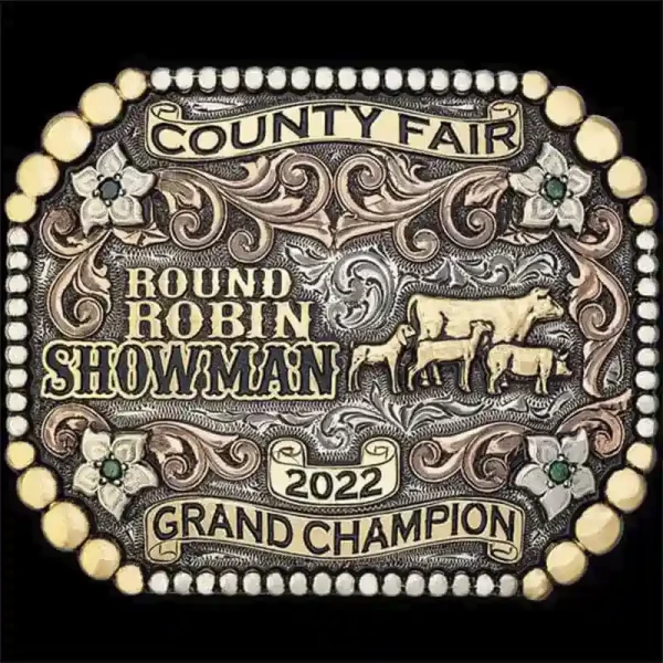 A custom livestock belt buckle for County Fair Round Robin Showman Champion featuring a goat, lamb, pig and cow figures