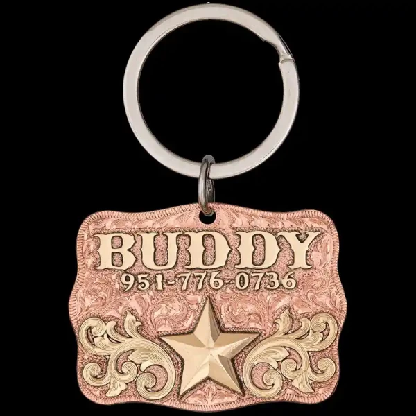 A custom dog tag with personalized engraved bronze lettering built on a copper base, featuring a gold star, western designed