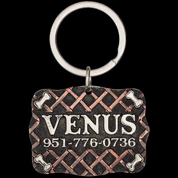 A custom dog tag with personalized engraved silver lettering built on matted silver base, featuring silver bones, western designed