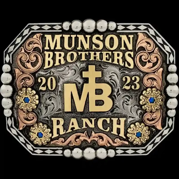A custom men's ranch belt buckle for Munson Brothers Ranch featuring its custom logo