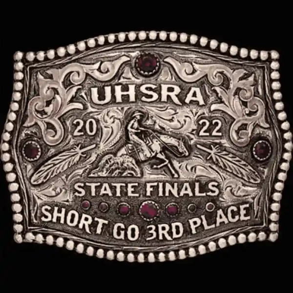 A custom women's rodeo belt buckle award for UHSRA State Finals featuring a reining cowgirl figure 