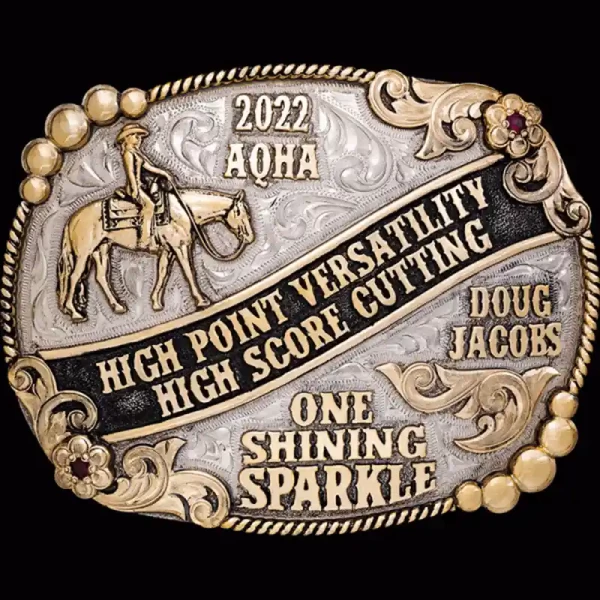 A custom oval western pleasure belt buckle trophy for AQHA Cutting High Point Versatility featuring a cowgirl figure 