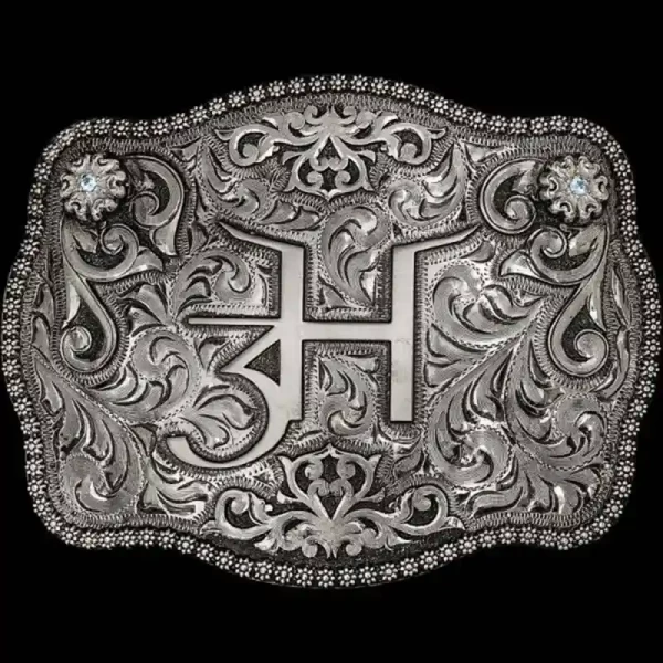 A custom silver belt buckle featuring a ranch brand logo