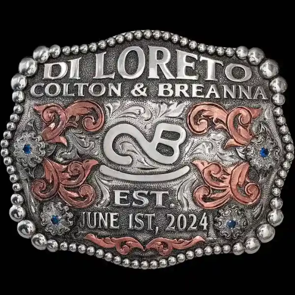 A custom silver belt buckle featuring a ranch brand logo