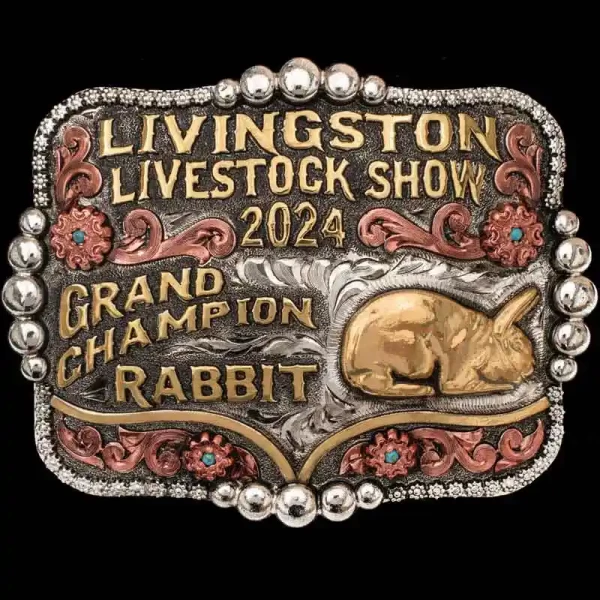 A custom trophy belt buckle for Livingston Livestock Show Grand Champion featuring a rabbit figure 