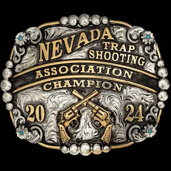 A custom trophy men's belt buckle for Nevada Trap Shooting Association Champion featuring crossed pistols figure 