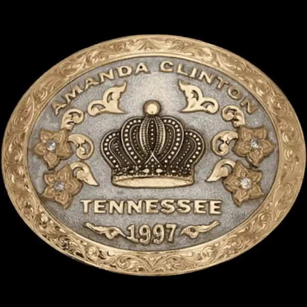 A custom oval rodeo queen belt buckle featuring a crown figure 