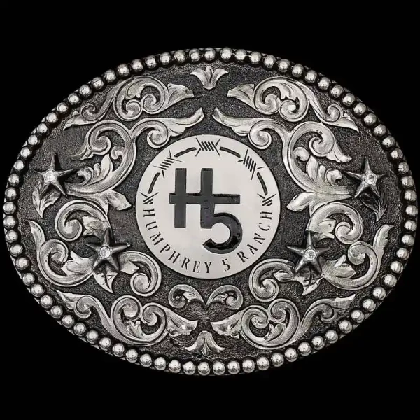 A custom oval antiqued ranch brand belt buckle for Humphrey 5 Ranch featuring its custom logo 
