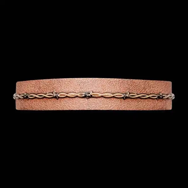 A copper cuff bracelet for men and women featuring a barbed wire decoration