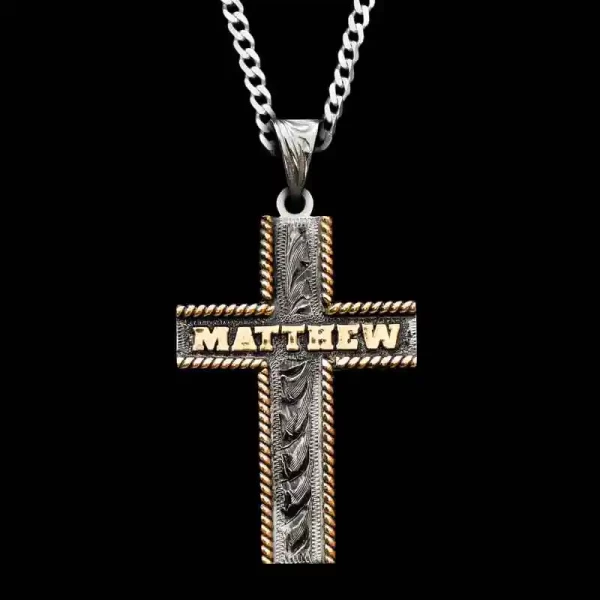A custom silver cross pendant necklace for men and women, western-inspired design. featuring bronze personalized name