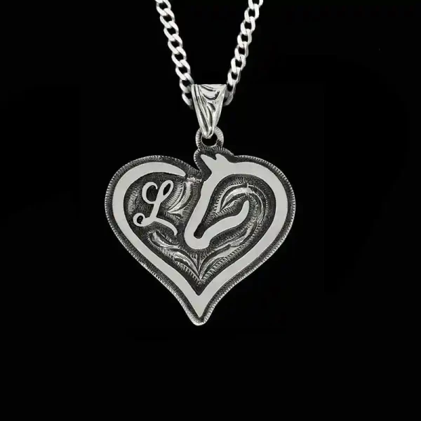 A custom heart pendant necklace built on a silver base, with a sterling silver chain