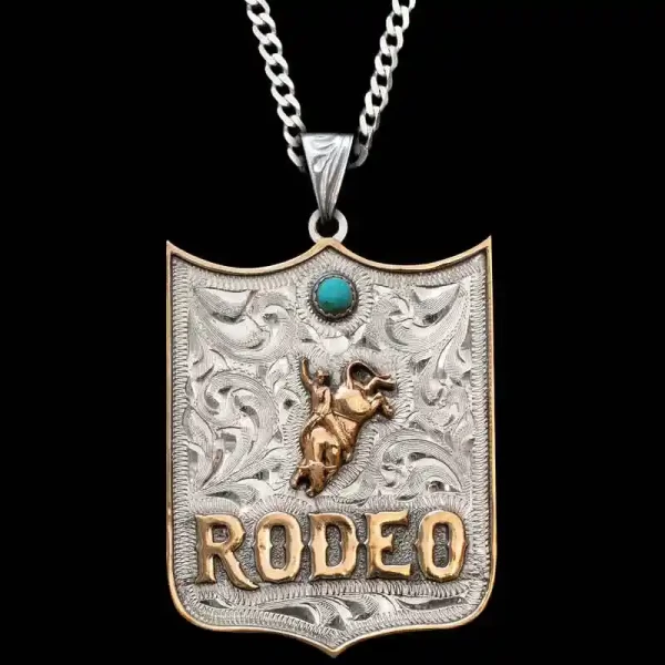 A custom pendant necklace featuring personalized bronze lettering and a bull rider figure, with a sterling silver chain 
