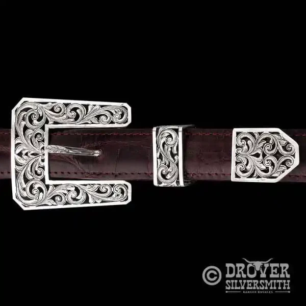 A square sterling silver belt buckle set featuring fine filigrane on buckle, loop and tip.  