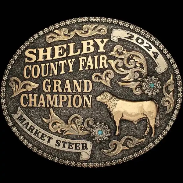 A custom golden award belt buckle for Shelby County Fair Grand Champion Market Steer featuring a cow figure 