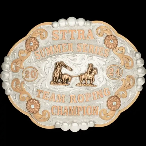 A custom rodeo belt buckle trophy for STTRA Summer Series Team Roping Champion featuring a team roper figure 