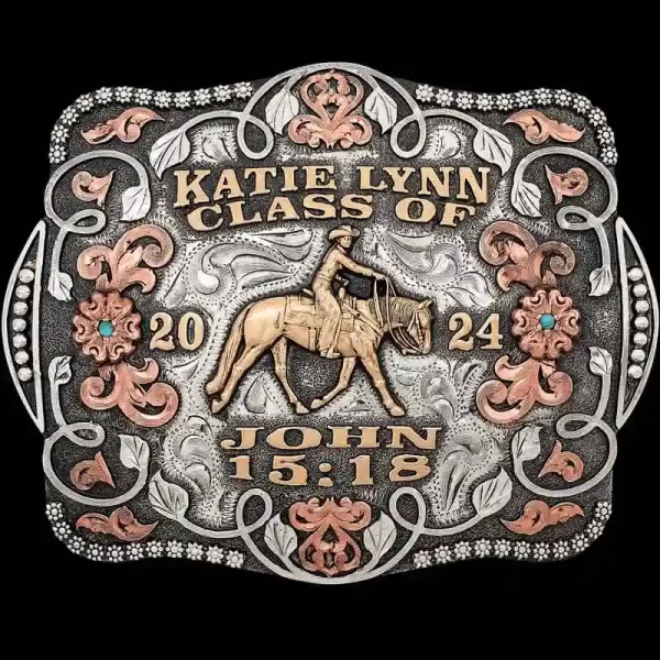 A custom women's graduation belt buckle featuring a cowgirl figure and bible verse 