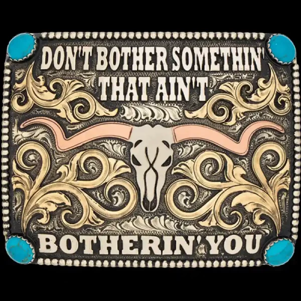 A custom square western belt buckle featuring a longhorn figure and a personalized quote 