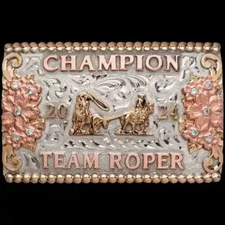 A custom rodeo box buckle trophy for Team Roping Champion designed for women