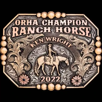 A custom western pleasure belt buckle trophy for ORHA Ranch Horse Champion featuring a cowgirl figure