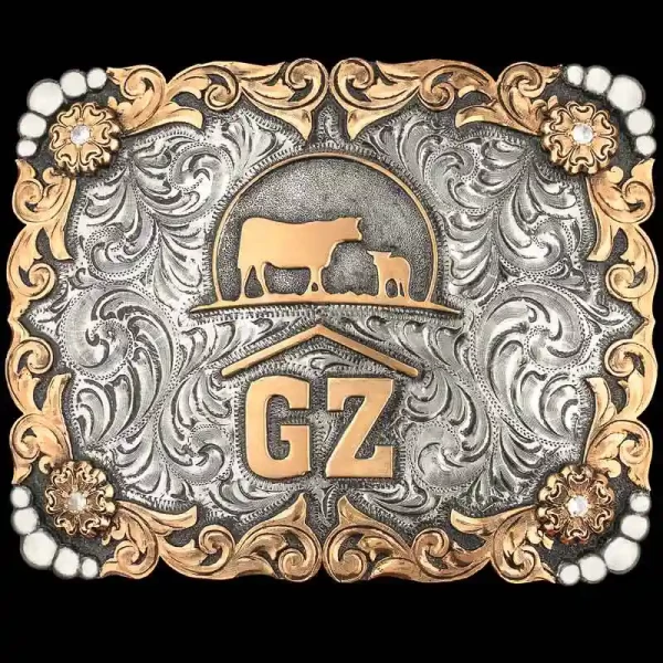 A custom ranch brand belt buckle featuring a cow and calf figure 