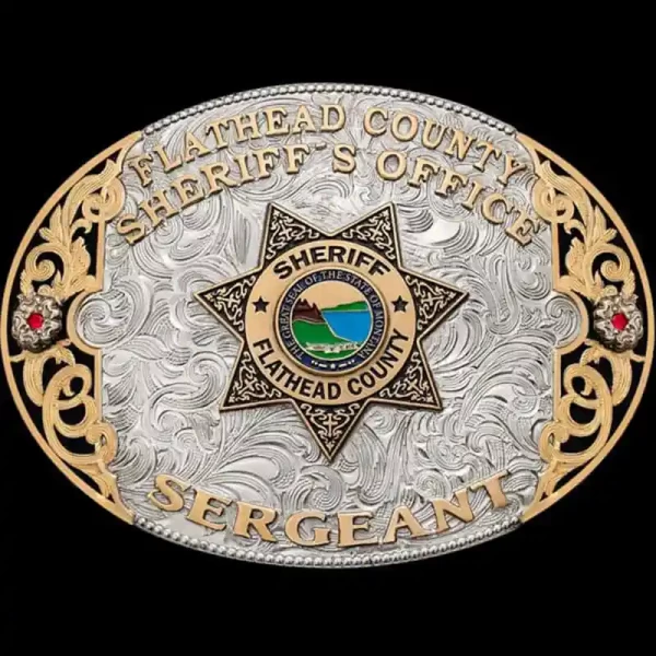 A custom oval sherrif belt buckle for Flathead County Sheriff's Office Sergeant featuring The Great Seal of The State of Montana emblem 