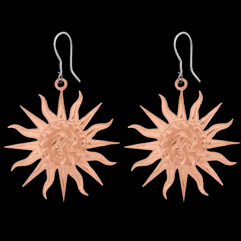 A pair of copper western earrings for women, sun shaped and hand engraved