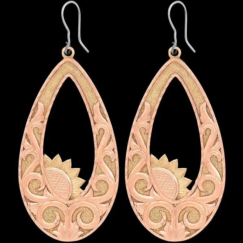A pair of copper western earrings for women, teardrop shaped, featuring copper scrollwork and sun figures 