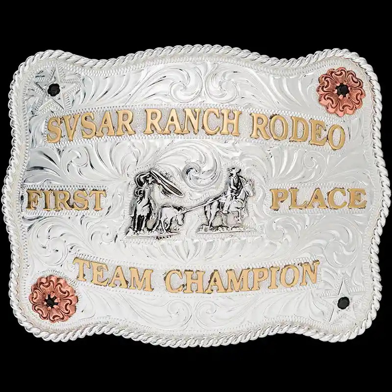 A custom silver plated rodeo belt buckle trophy for SVSAR Ramch Rodeo Champion featuring a team roping figure 