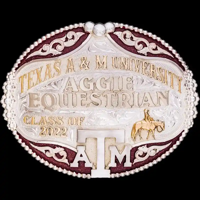 A custom oval graduation belt buckle for Texas A&amp;M University Equestrian Team featuring a cowgirl figure 