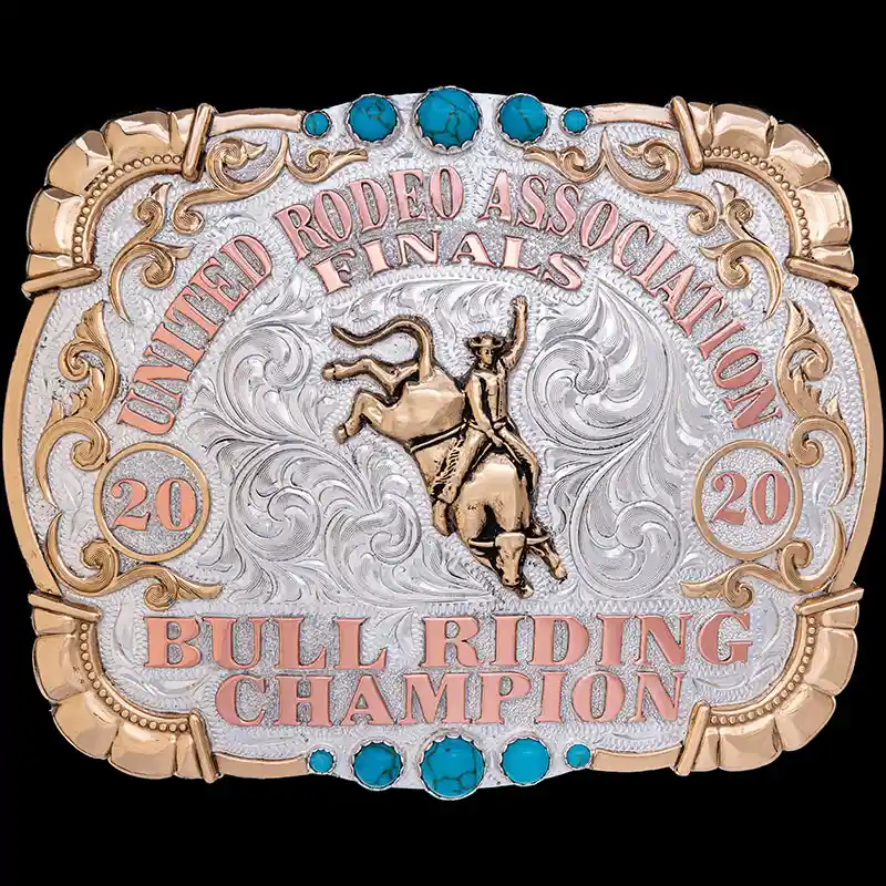 A custom rodeo belt buckle trophy for United Rodeo Association Bull Riding Champion featuring a bull rider figure and turquoise stones