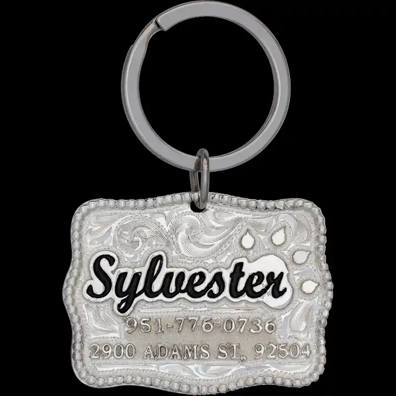 A custom cat tag with personalized engraved silver lettering built on a silver plated base, featuring a cat paw, western designed 
