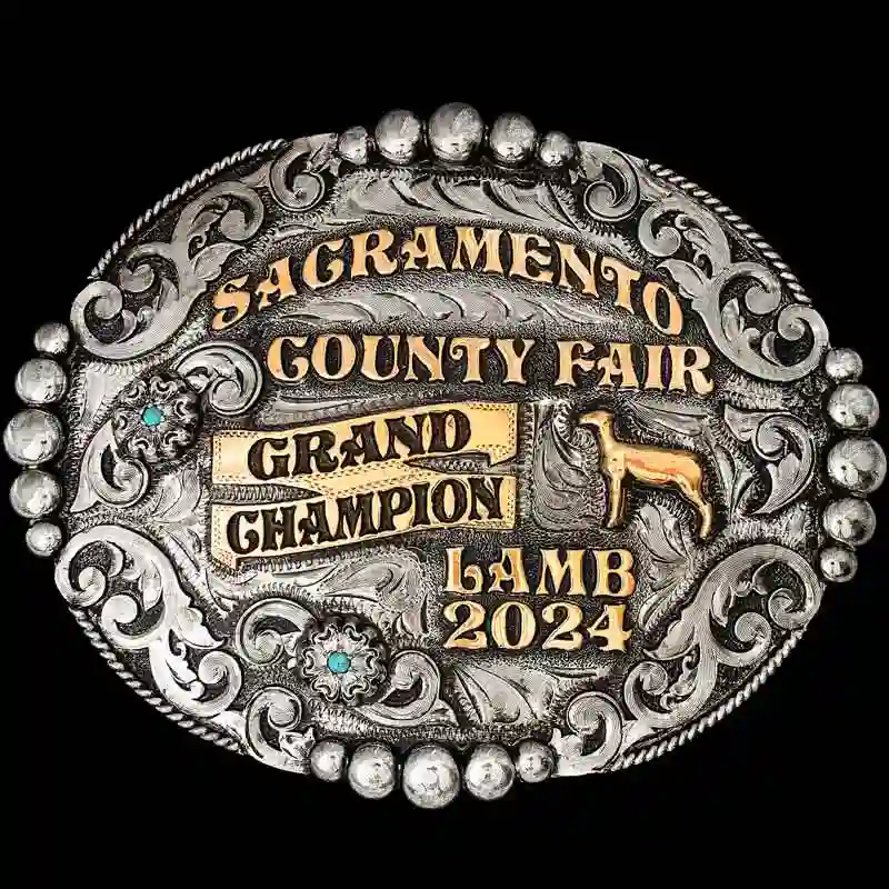 A custom oval lamb belt buckle trophy for Sacramento County Fair Grand Champion featuring a lamb figure 